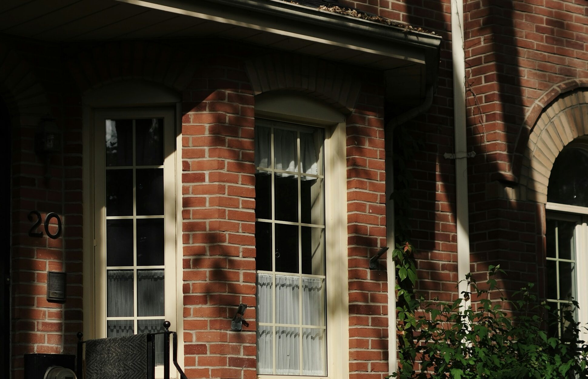 Brick townhouse entry in warm evening light